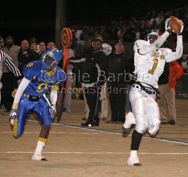 Lance Lewis catches a touchdown pass over a Carver defender. 